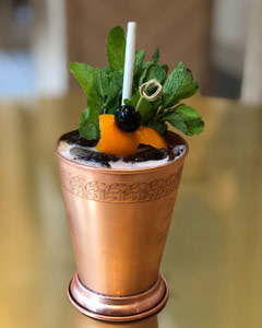 A cocktail from Hotel Revival in historic downtown Baltimore with a biodegradable straw