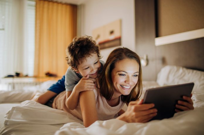 Mother and son using a digital tablet - data