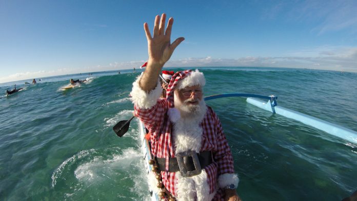 Santa arriving at Waikiki beach
