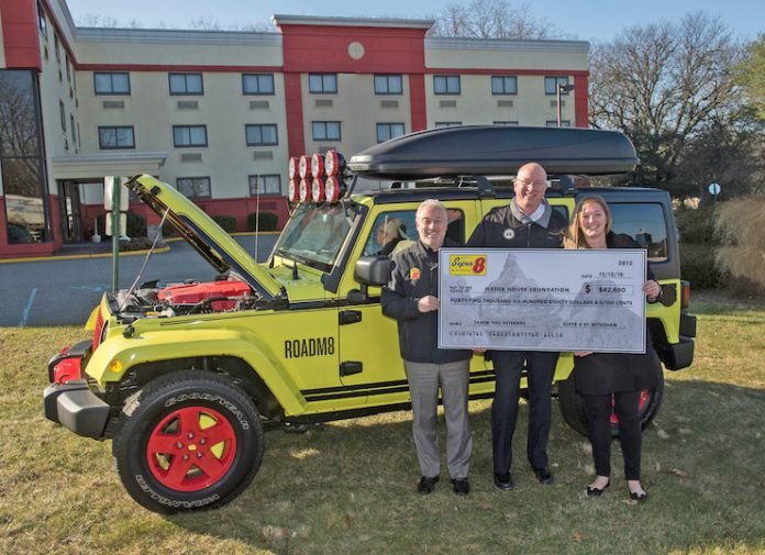 Super 8 by Wyndham presents a check for $42,680 to Fisher House Foundation following the sale of the brand's ROADM8 concept car. From left, Mike Mueller, brand leader and SVP of operations for Super 8; David Coker, president, Fisher House Foundation; and Haley Maglio, senior manager of operations for Super 8.