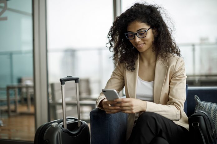 Business traveler using a hotel app