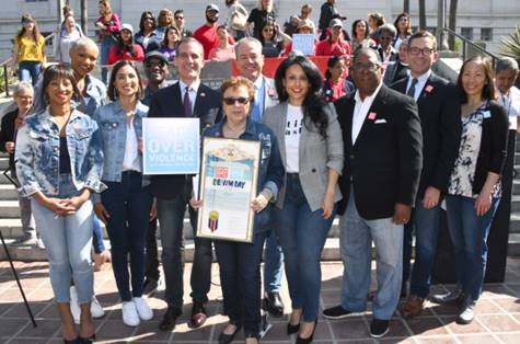 AHLA SVP of Government Affairs & Industry Troy Flanagan stands with Los Angeles Mayor Eric Garcetti, Los Angeles County Supervisor Mark Ridley-Thomas, Councilwoman Nury Martinez, Executive Director of Peace Over Violence Patti Giggans, Denim Day Spokespeople Maya Jupiter and Aloe Blacc, Denim Day Model and survivor Danah Cleaton, actress and advocate Monique Coleman, and others at the 20th annual Denim Day press conference and rally.