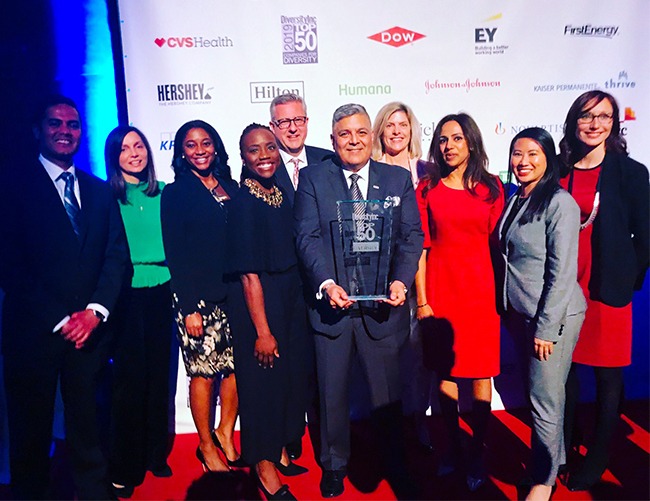 Jon Muñoz (center), Matthew Schuyler and Hilton team celebrate their ranking on the 2019 DiversityInc Top 50 Companies for Diversity list. Muñoz, VP of global diversity and inclusion at Hilton, was recently elected as chairman of the Board of Directors for the International LGBTQ+ Travel Association during the organization’s Annual Global Convention.