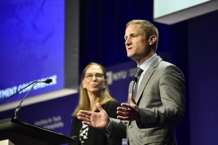 Nicolas Graf, associate dean of the NYUSPS Jonathan M. Tisch Center of Hospitality, announces a new scholarship program, while NYUSPS Interim Dean Susan Greenbaum looks on. (Photo credit: Tom Weis/NYUSPS)