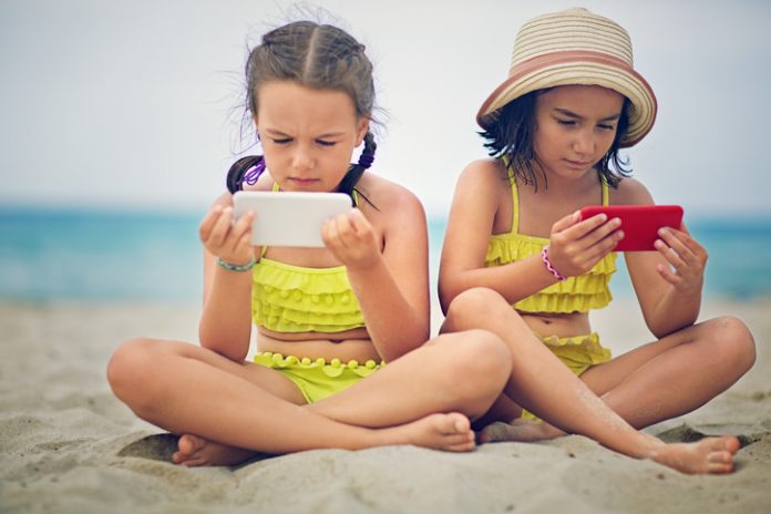 Digital detox - phones on the beach