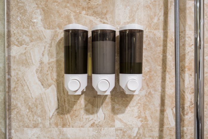Box of Soap, shampoo, conditioner hang on wall in bathroom bulk amenities