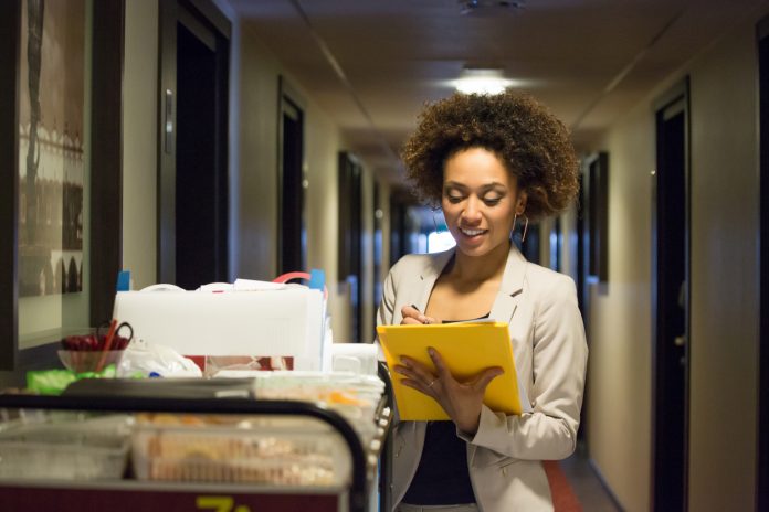 Women checks list during inspection