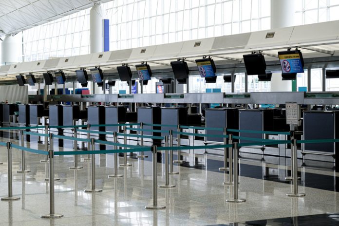 Airport check in counter with no people.