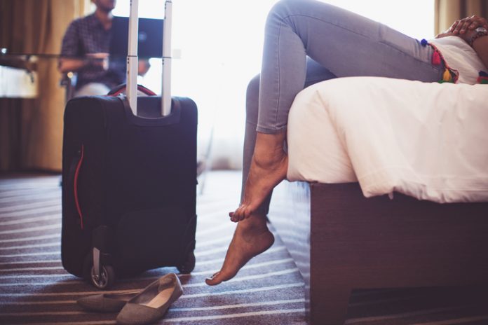 travelers arrive in hotel room