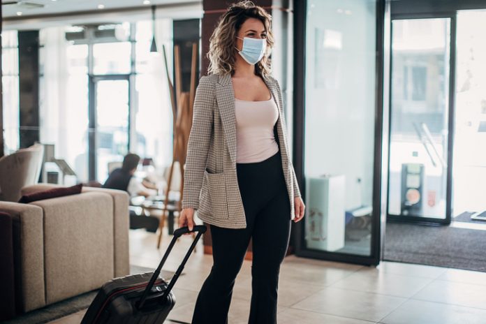 Business traveler wearing a facemask in 2020
