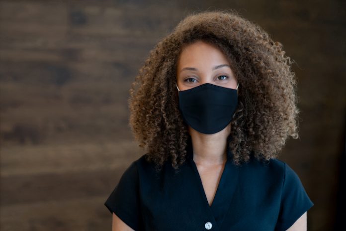 spa worker with face mask