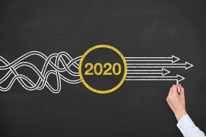 Person drawing arrows out of 2020 - solutions concept