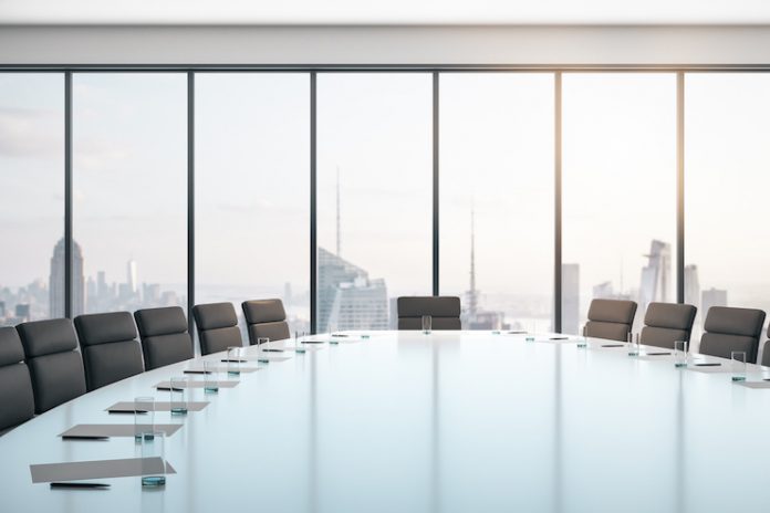 Photo of a boardroom, conference room with empty chairs — Diversity of boards concept: 