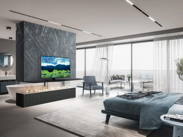 Luxurious master bedroom interior with TV fixed to wall