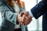 man and woman shaking hands making a deal