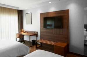 Hotel room with TV and desk stock