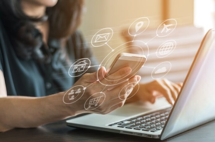 IOT Multichannel online banking payment communication network digital technology internet wireless application development mobile smartphone sync app: Business woman holding smart phone icon flow